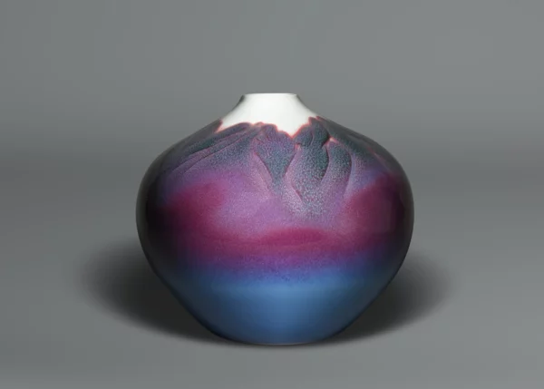 Arita porcelain vase depicting misty mountains in shades of pink, purple and blue glaze