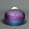 Arita porcelain vase depicting misty mountains in shades of pink, purple and blue glaze