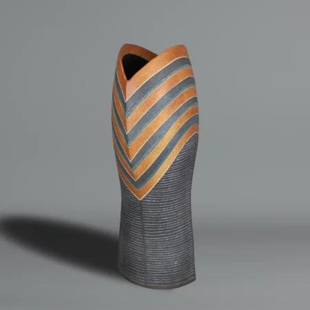 Ichino Masahiko A tall and sculptural ceramic vase, the upper section with stripes in blue, dark orange, and black enamel,